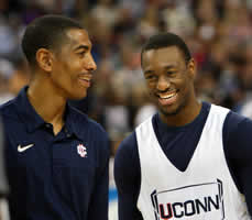Kevin Ollie-L and Kemba Walker-R